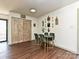 A cozy dining area features a dining table with green chairs and decorative wall art at 4516 Jamee Dr, Gastonia, NC 28056