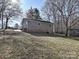 Exterior view of a one-story home with neutral siding, a brick foundation, and a well-maintained yard at 4516 Jamee Dr, Gastonia, NC 28056