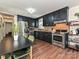 Spacious kitchen features black cabinets, stainless steel appliances, and a breakfast table at 4516 Jamee Dr, Gastonia, NC 28056