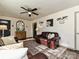 Cozy living room features hardwood floors, neutral paint, and an elegant leather sofa at 4516 Jamee Dr, Gastonia, NC 28056
