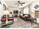 Spacious living room features a stone fireplace, hardwood floors, and comfortable leather sofas at 4516 Jamee Dr, Gastonia, NC 28056