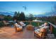 Beautiful back deck with lake views, comfortable seating, and an elegant outdoor dining set at 5005 Autumn Blossom Ln, Waxhaw, NC 28173