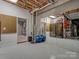Functional basement area with workout equipment, storage, and utility access at 5005 Autumn Blossom Ln, Waxhaw, NC 28173