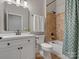 Bathroom featuring single sink, white cabinets, and tile surround at 5005 Autumn Blossom Ln, Waxhaw, NC 28173