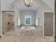 This primary bathroom features a luxurious soaking tub, walk-in shower, and neutral tile surround at 5005 Autumn Blossom Ln, Waxhaw, NC 28173