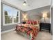 Cozy bedroom featuring a large window with plenty of light and stylish decor creating a relaxing atmosphere at 5005 Autumn Blossom Ln, Waxhaw, NC 28173