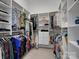 Walk-in closet with custom shelving and ample storage space for clothing and accessories at 5005 Autumn Blossom Ln, Waxhaw, NC 28173