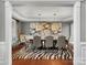 Elegant dining room featuring a zebra print rug, decorative light fixtures and stylish artwork enhancing the space at 5005 Autumn Blossom Ln, Waxhaw, NC 28173