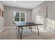 Recreation room with ping pong table and natural lighting at 5005 Autumn Blossom Ln, Waxhaw, NC 28173