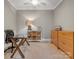 Dedicated home office with ample storage and a stylish glass desk at 5005 Autumn Blossom Ln, Waxhaw, NC 28173