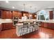 Spacious kitchen features a central island with seating, custom cabinetry, and stainless steel appliances at 5005 Autumn Blossom Ln, Waxhaw, NC 28173