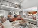 Open-concept living room with soaring ceilings, hardwood floors, neutral furnishings, and an adjacent kitchen at 5005 Autumn Blossom Ln, Waxhaw, NC 28173