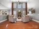 Bright living room with soaring ceilings, a stone fireplace, and large windows at 5005 Autumn Blossom Ln, Waxhaw, NC 28173