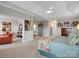 Expansive main bedroom featuring a tray ceiling, sitting area and serene views, designed for ultimate relaxation at 5005 Autumn Blossom Ln, Waxhaw, NC 28173