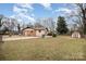 Spacious backyard with a chain-link fence, a shed, and plenty of room for recreation and relaxation at 5310 Myrica Ln, Charlotte, NC 28213