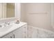 Bathroom features white vanity with drawers, marble tile floor, and chrome fixtures at 5310 Myrica Ln, Charlotte, NC 28213