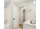 Updated bathroom featuring a white vanity, tub with shower, and open doorway to the next room at 5310 Myrica Ln, Charlotte, NC 28213