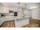 Modern kitchen boasts stainless steel appliances, granite countertops, and a stylish central island at 5310 Myrica Ln, Charlotte, NC 28213