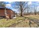 Expansive backyard featuring a brick home, mature trees, and a lush lawn at 605 18Th Nw St, Hickory, NC 28601