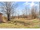 Expansive backyard featuring a sprawling lawn and mature trees providing ample shade at 605 18Th Nw St, Hickory, NC 28601