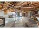 Spacious unfinished basement area with exposed ceiling and walls, and shelving at 605 18Th Nw St, Hickory, NC 28601