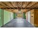 Unfinished basement with exposed ceiling and walls, and sliding glass door to the yard at 605 18Th Nw St, Hickory, NC 28601
