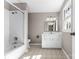 White bathroom featuring a shower, vanity and window with natural light at 605 18Th Nw St, Hickory, NC 28601