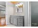 This bathroom features a grey vanity with a light countertop, as well as a wood ceiling for a nice contrast at 605 18Th Nw St, Hickory, NC 28601