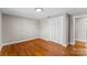 Neat bedroom featuring hardwood floors, a closet, and neutral-toned walls at 605 18Th Nw St, Hickory, NC 28601