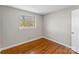 Bright bedroom featuring hardwood floors, neutral paint and a bright window at 605 18Th Nw St, Hickory, NC 28601