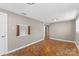 Cozy bedroom showcasing parquet wood flooring, neutral walls, and a unique shuttered window at 605 18Th Nw St, Hickory, NC 28601