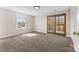 Carpeted bedroom featuring bright light through the windows and doors at 605 18Th Nw St, Hickory, NC 28601