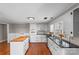 Bright kitchen features all white cabinetry, a dark countertop, an island and stainless steel appliances at 605 18Th Nw St, Hickory, NC 28601
