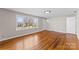 Spacious living room featuring hardwood floors, a large window, and neutral-toned walls at 605 18Th Nw St, Hickory, NC 28601