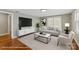Inviting living room with sleek entertainment center, modern decor, and ample natural light at 605 18Th Nw St, Hickory, NC 28601