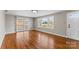 Bright living room with hardwood floors, neutral walls, and sliding door access at 605 18Th Nw St, Hickory, NC 28601