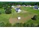 Expansive lot with well-maintained lawn featuring home, shed, and lush green trees in a desirable neighborhood at 623 Plowshare Way, Clover, SC 29710