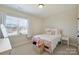 Bright bedroom featuring a pink bed frame, basket of toys and natural lighting at 623 Plowshare Way, Clover, SC 29710