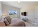 Comfortable bedroom with window views, closet, and mounted TV at 623 Plowshare Way, Clover, SC 29710