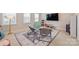 Bright bonus room featuring a rug, chairs, and TV, perfect for relaxation at 623 Plowshare Way, Clover, SC 29710