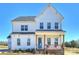 Charming two-story home with white siding, covered porch, and brick accents in a desirable location at 623 Plowshare Way, Clover, SC 29710