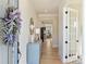 Welcoming foyer featuring hardwood floors, neutral walls, decorative accents, and an open doorway to the living area at 623 Plowshare Way, Clover, SC 29710