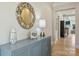 Stylish foyer featuring hardwood floors, modern decor, and a glimpse of the living area at 623 Plowshare Way, Clover, SC 29710