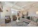 Open-concept living room with stylish furniture, coffered ceilings, and views to the kitchen at 623 Plowshare Way, Clover, SC 29710