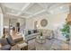 Cozy living room with coffered ceilings, plush seating, and natural light at 623 Plowshare Way, Clover, SC 29710