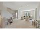 Spacious carpeted living room with neutral furniture and ample natural light from windows at 623 Plowshare Way, Clover, SC 29710