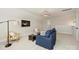 Bright loft featuring a blue couch, sleek lighting, and a comfortable seating area at 623 Plowshare Way, Clover, SC 29710