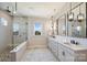 Luxurious bathroom boasting double sinks, marble counters, and a glass-enclosed shower at 623 Plowshare Way, Clover, SC 29710