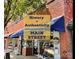 Charming Main Street storefront with brick facade, awnings, and a vibrant commercial presence at 623 Plowshare Way, Clover, SC 29710