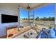 Relaxing screened porch offers an outdoor TV and peaceful views at 623 Plowshare Way, Clover, SC 29710